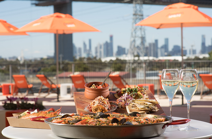 An outdoor bar underneath the Westgate bridge.